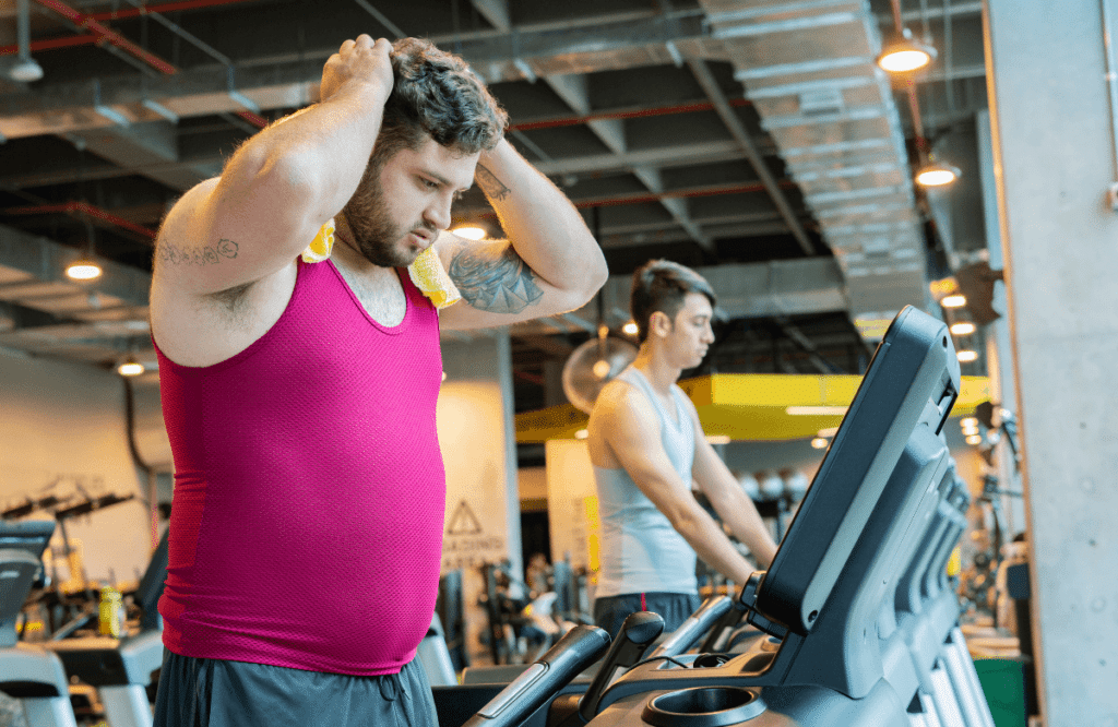 An overweight man using the best treadmill wtih decline