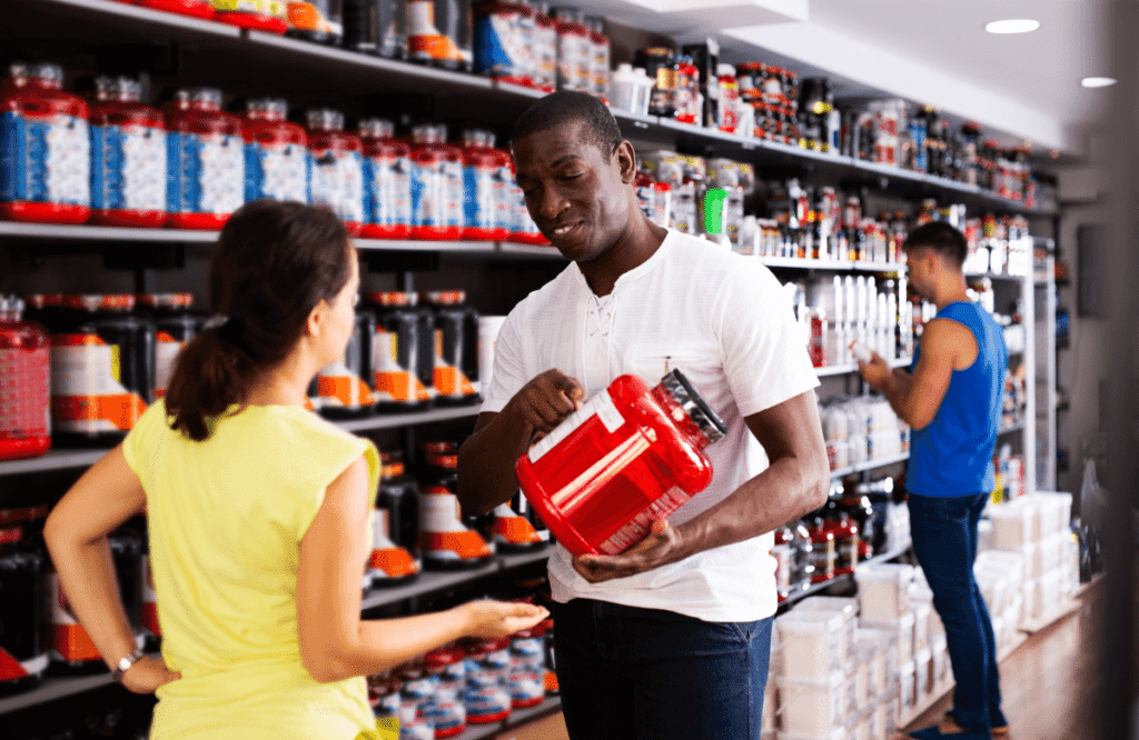 A man explaining what is non-stim pre-workout to a woman