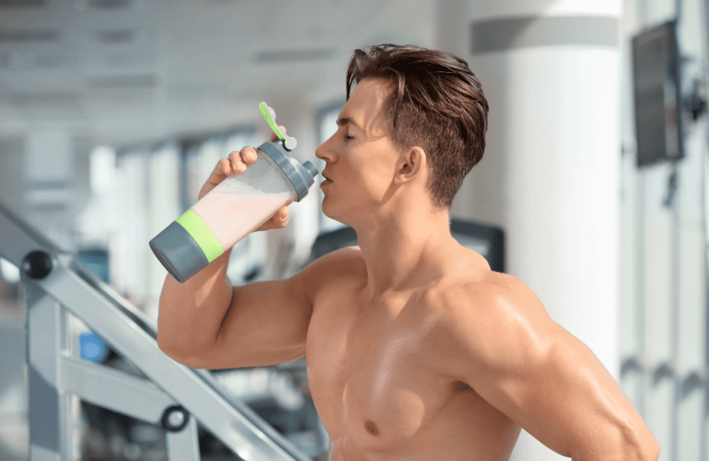 A man at the gym drinking his non-stim pre-workout preparation