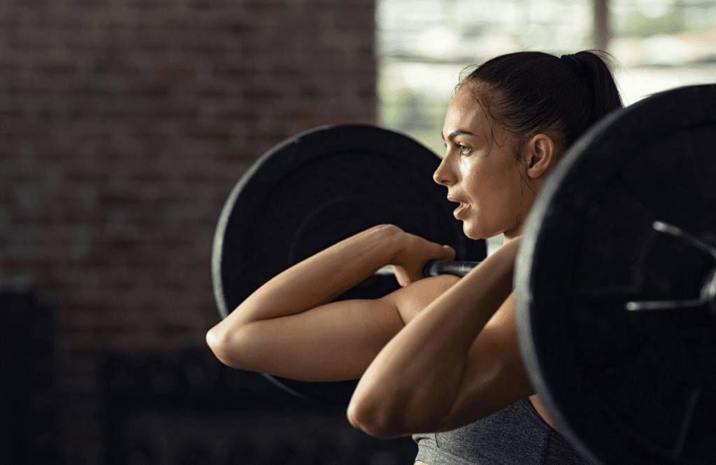 A woman doing deadlift variations during her deadlift routine