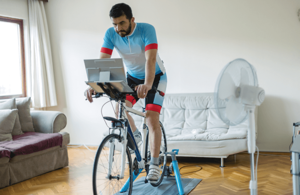 A man using a stationary bike at home