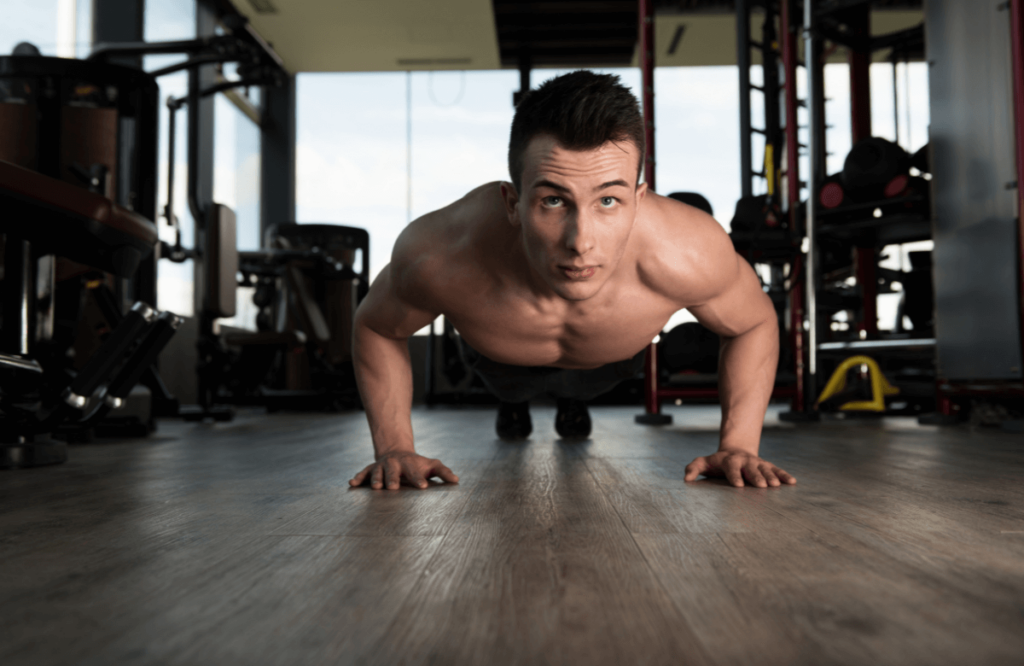 A man looking for hypertrophy during press-ups