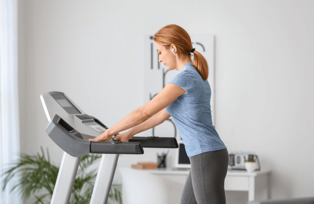 woman using a treadmill upstairs