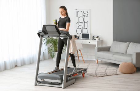 A man using one of the best treadmills with Netflix