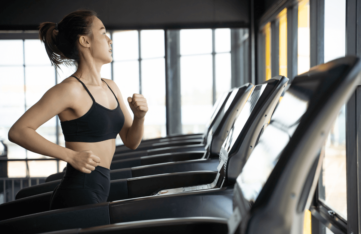 A woman wondering what is a mile on a treadmill