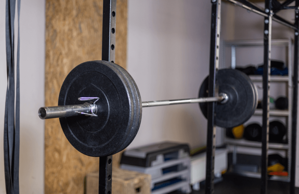 A squat rack with a barbell on it