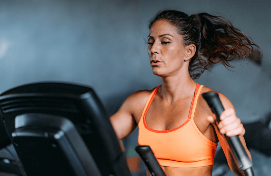 A woman doing a 30 min elliptical workout routine