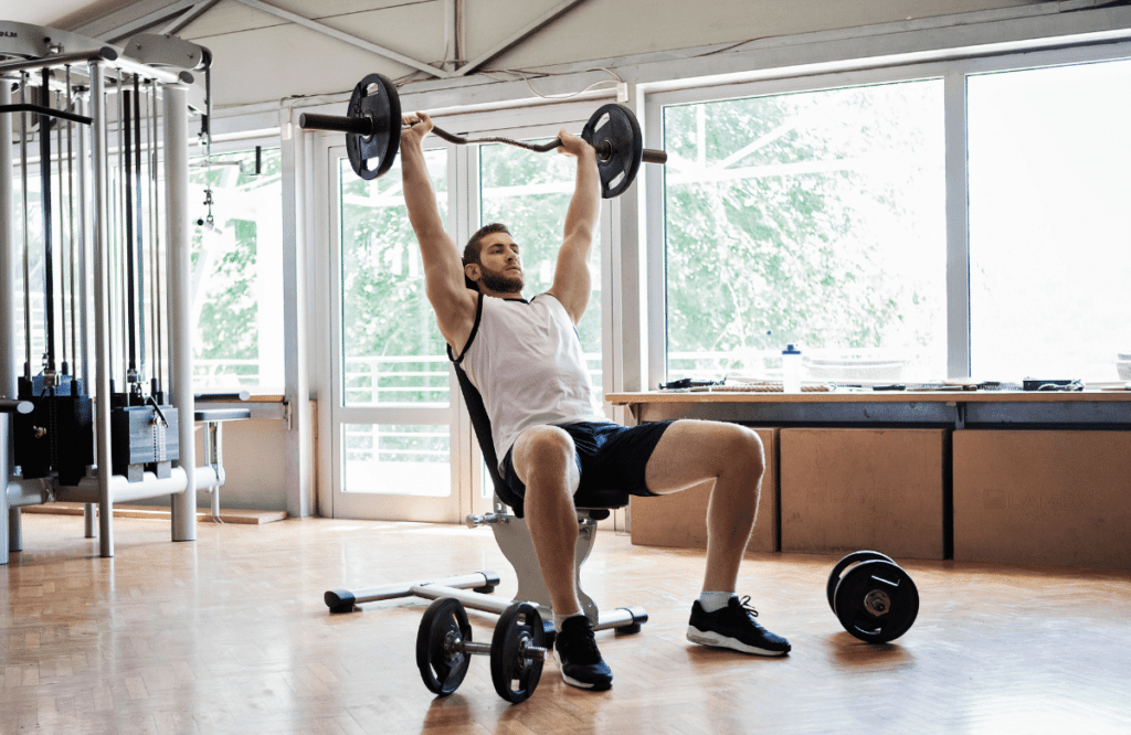 A man using the best weight bench at the gym