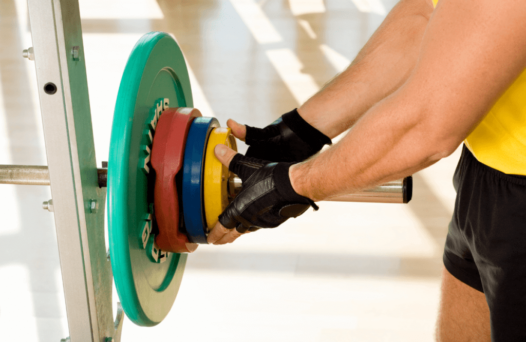 A man preparing a deadlift bar on the best weight bench