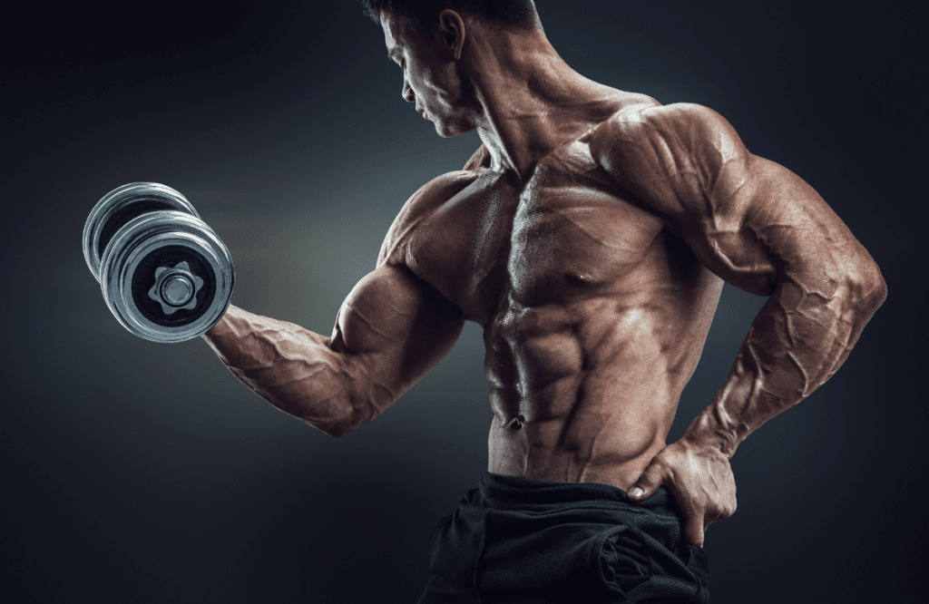 A strong man working out to reach 17-inch bicep size