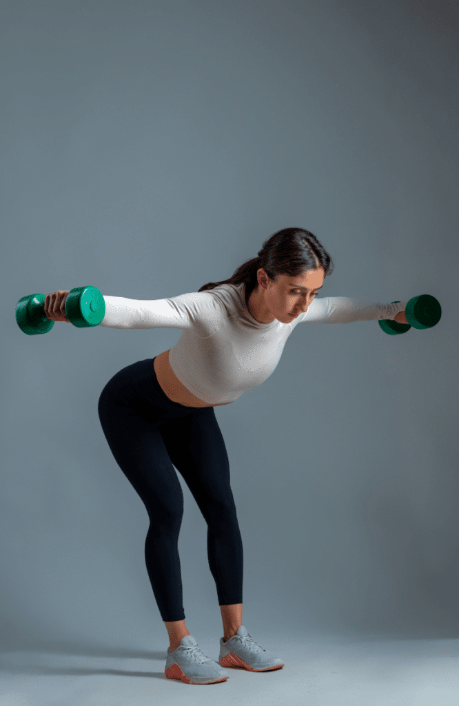 a woman doing the rear delt fly exercise