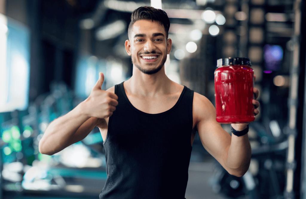 A happy man with a box of certified pre-workout