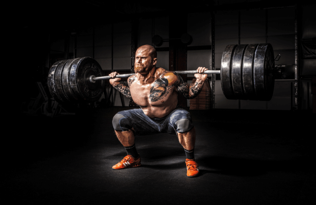 A strong man building muscle while weightlifting