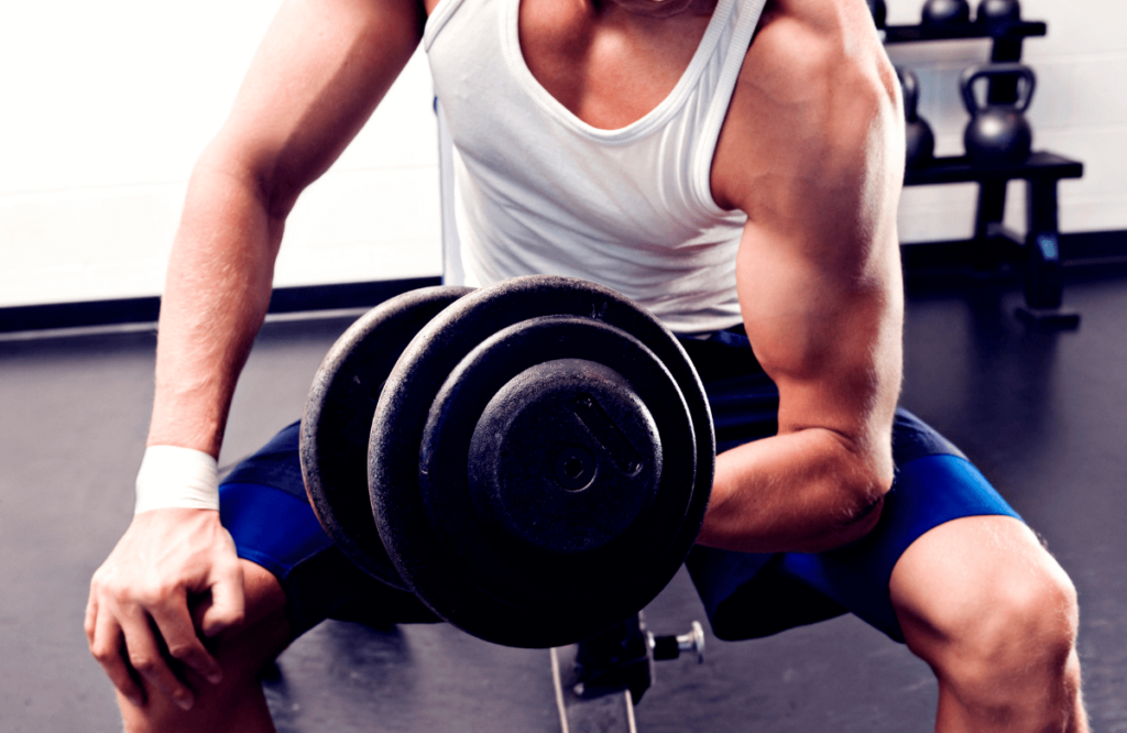 A man doing bicep curls with an heavy dumbbell