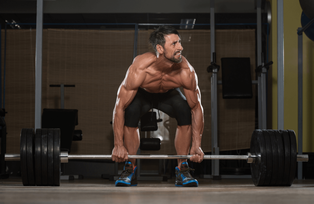 A man doing rack pulls with the right position