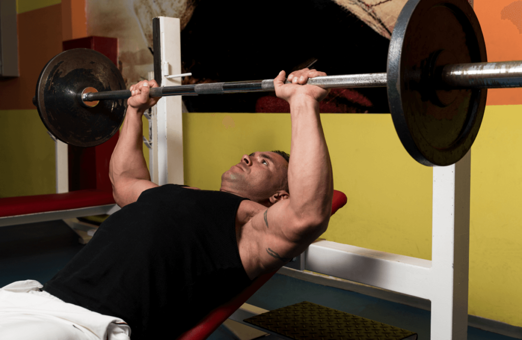 A man with veiny arms weightlifting