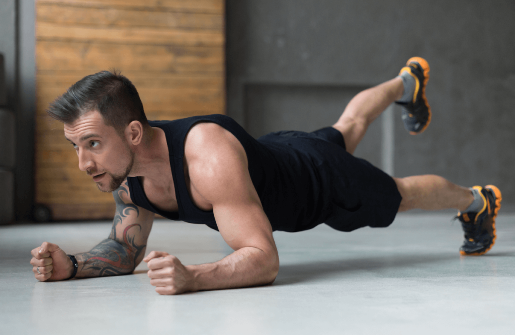 A man doing planks variations at home