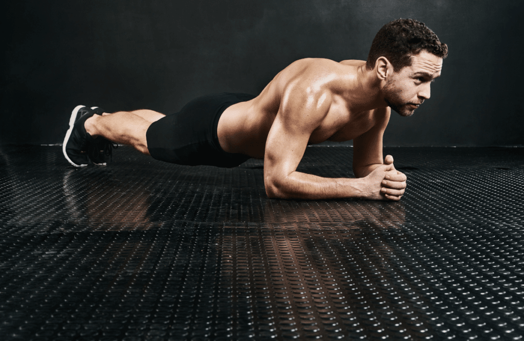 A man doing the plank, one of the many core exercises