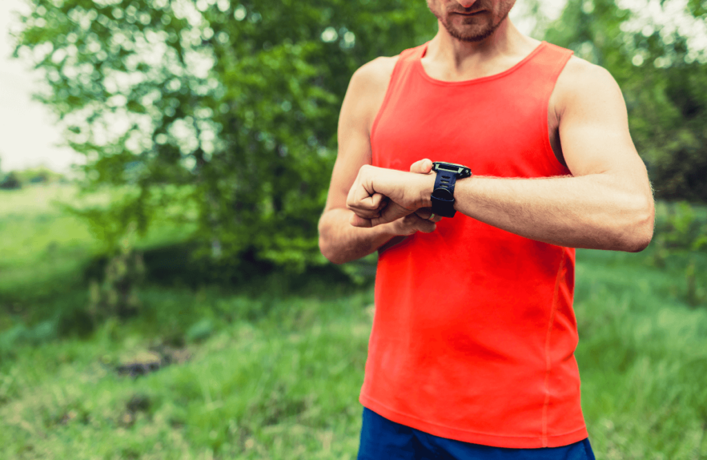 A man running outside using one of the best sports watches for men