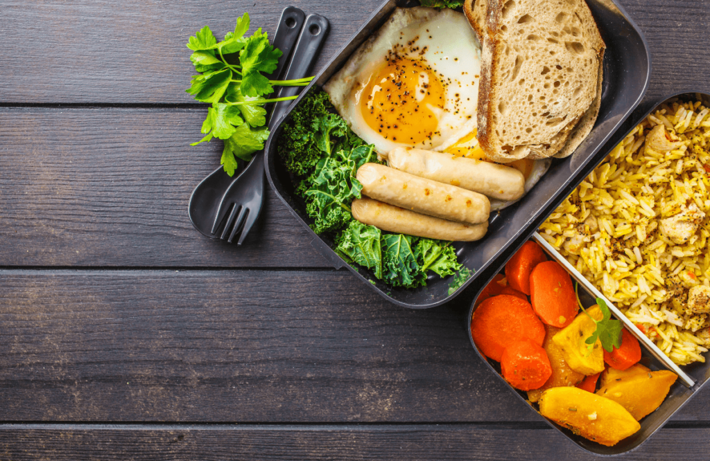 A meal prep with eggs sausages and rice to gain muscle