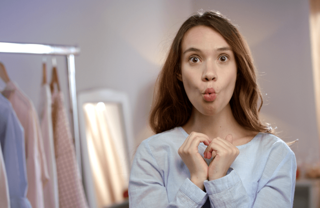 A woman doing face exercises to lose face fat