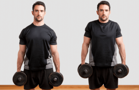A man performing dumbbell shrugs