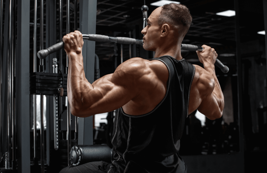 Man doing lat pulldowns in a gym