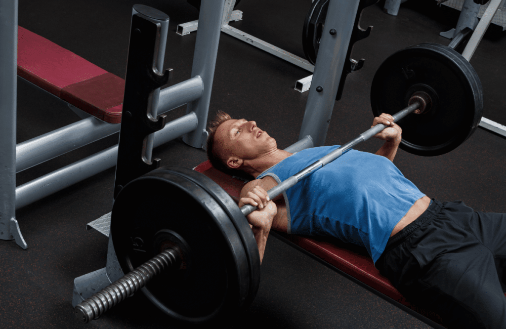 A man performs bench press