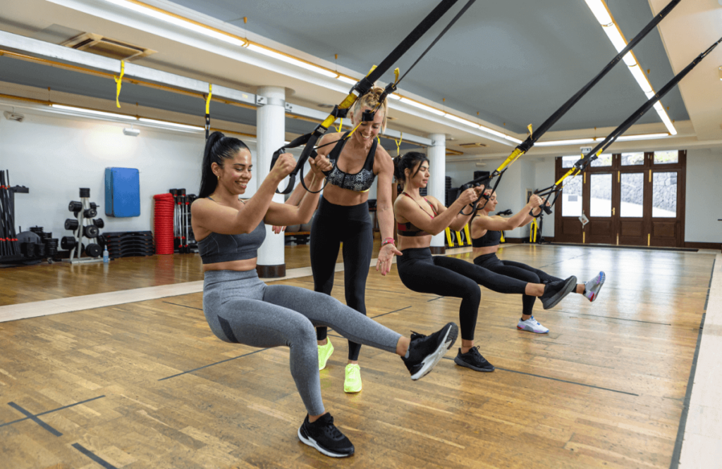 Crossfit group does a trx workout