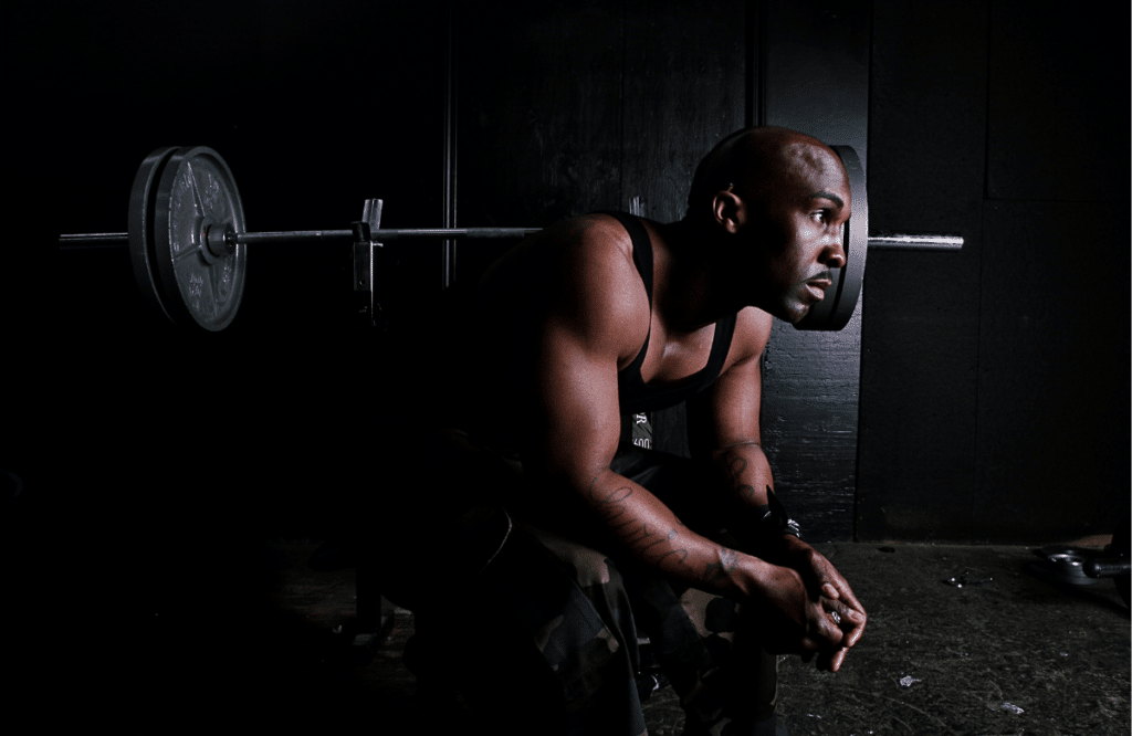 Man sitting on bench after bench pressing