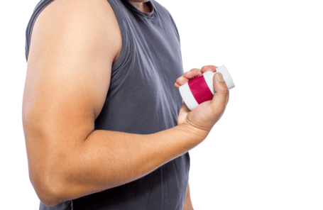 A man holds a box of fat burning pills
