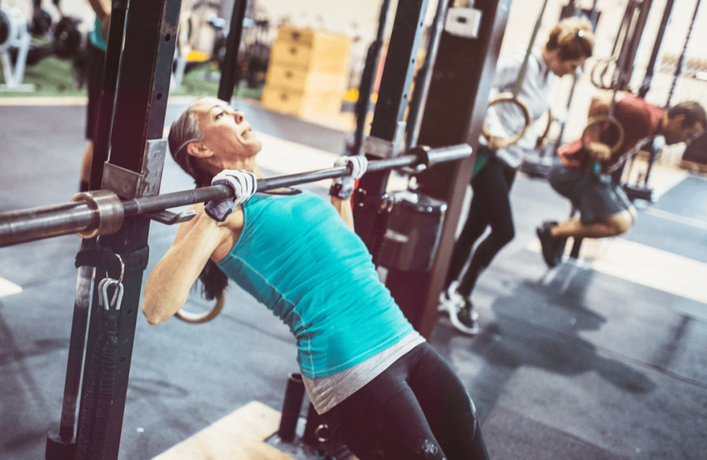 Woman does reverse rows in gym