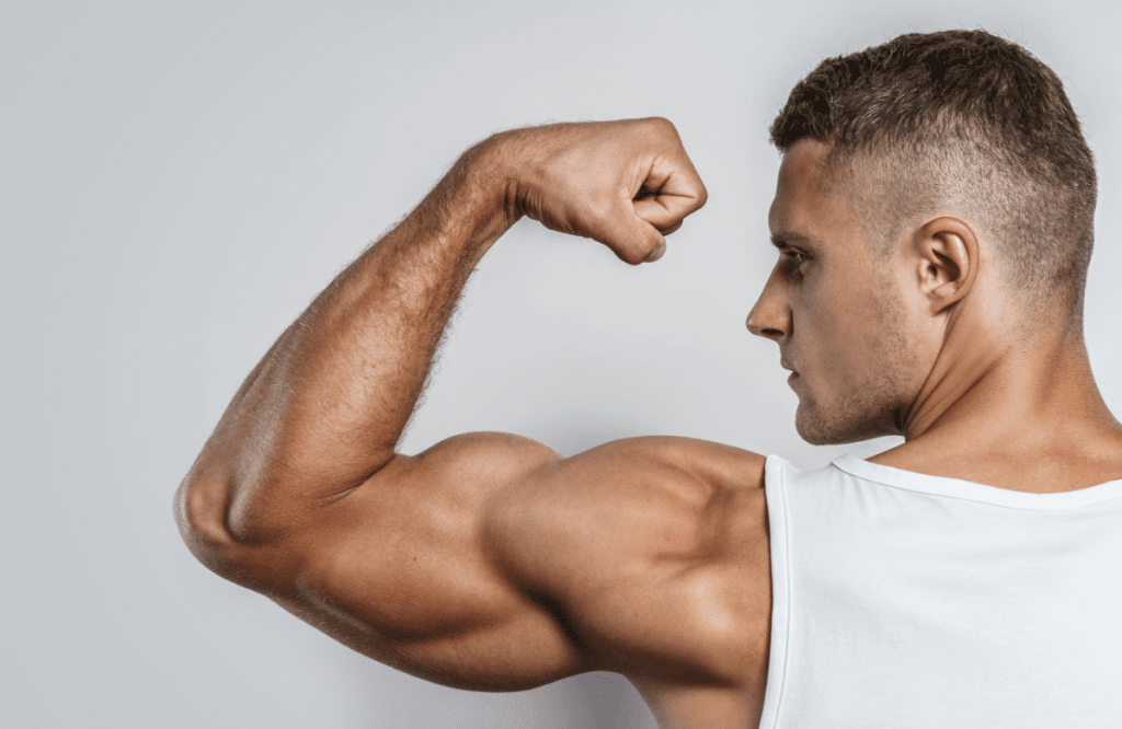 Man shows arm muscles