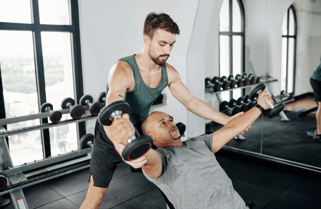 A man does dumbbell flies