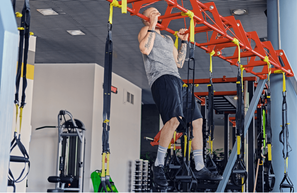 A man dies neutral grip pull-ups in a gym