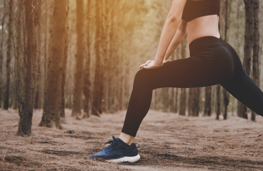 Woman does stretches in the forest