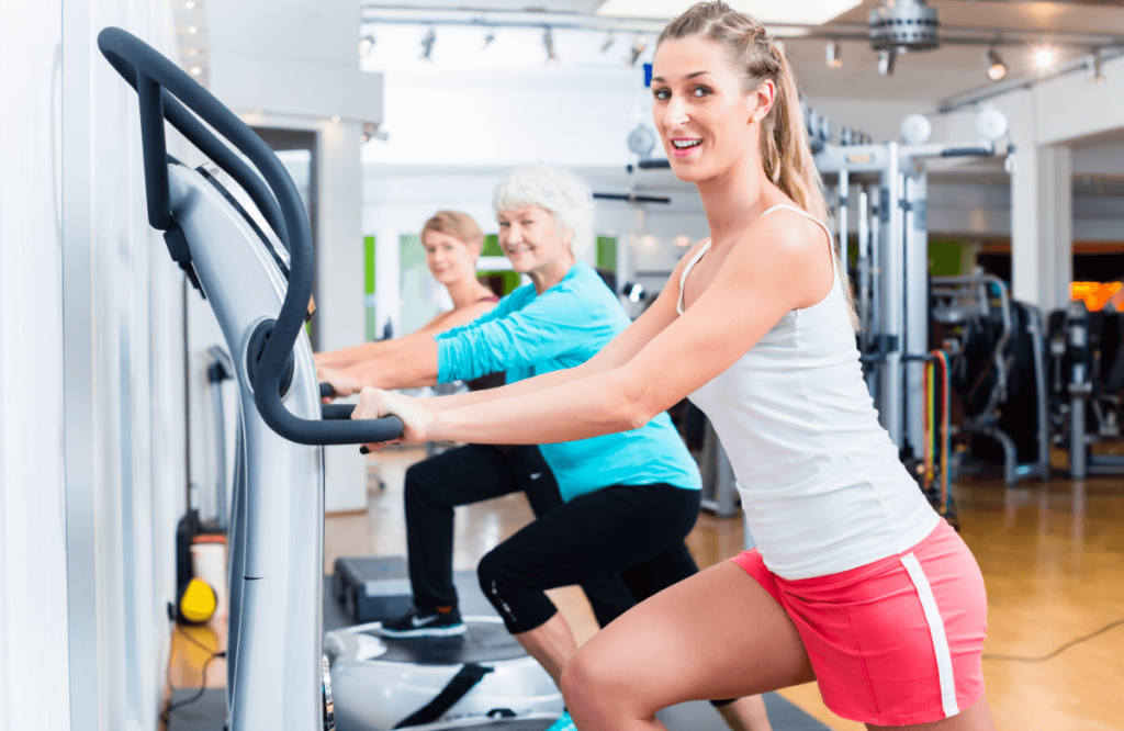 A group of women train on vibration plate