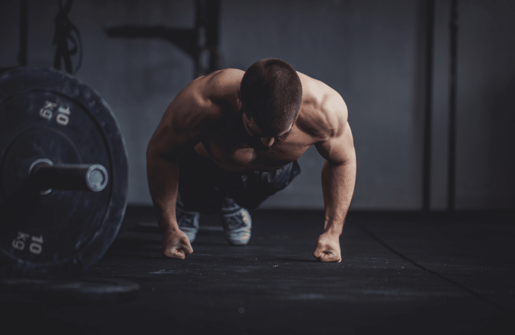 A man does pushups on his fists