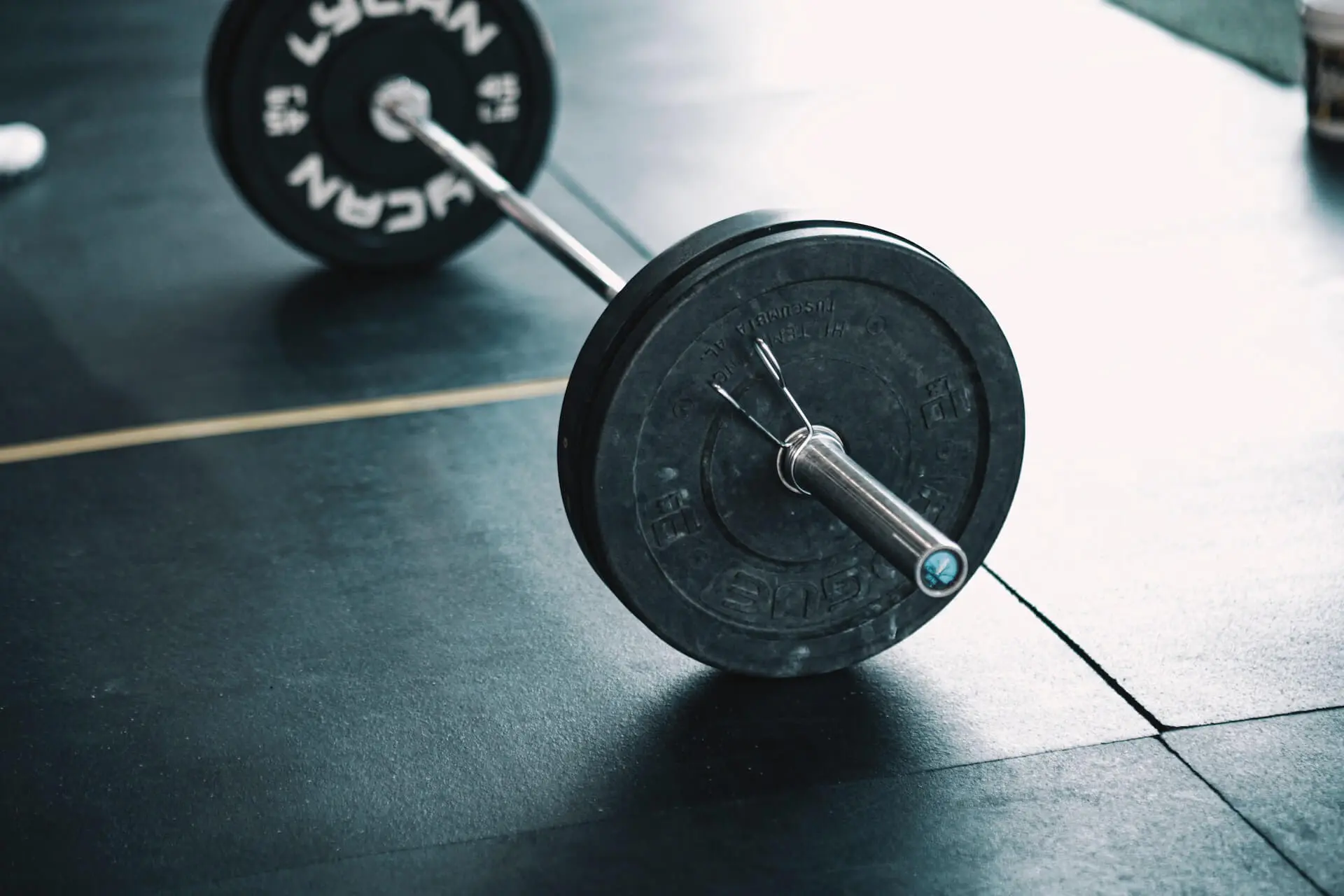 a barbell standing on the floor