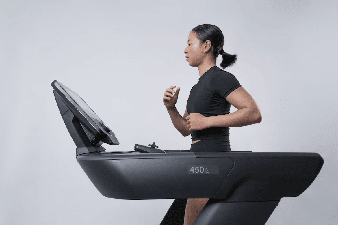 a woman following its couch to 5k plan on treadmill