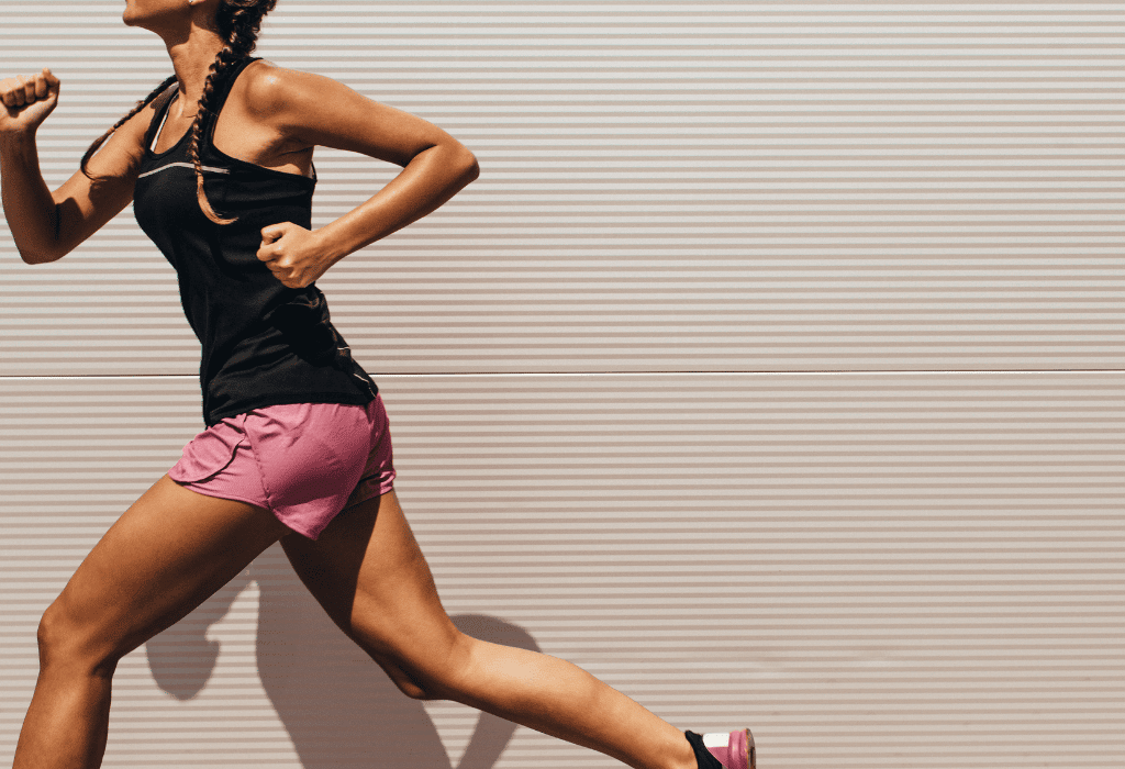 a woman running barefoot on a treadmill