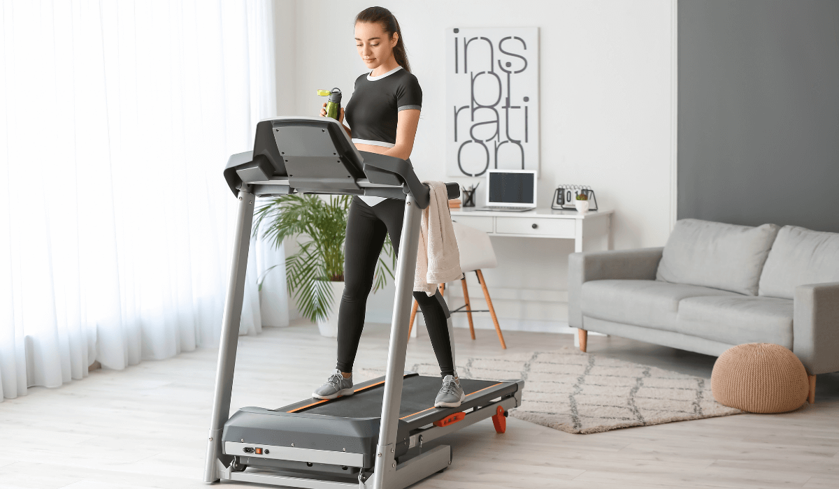 A woman using the used treadmill she bought