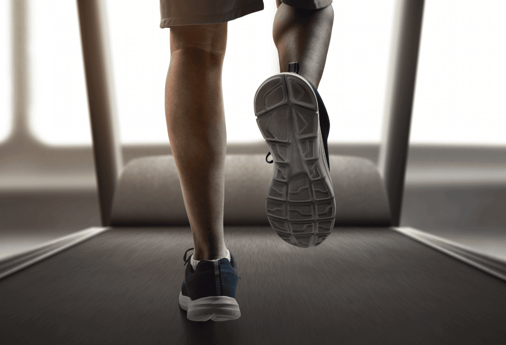 a man using incline treadmill to improve calories burned