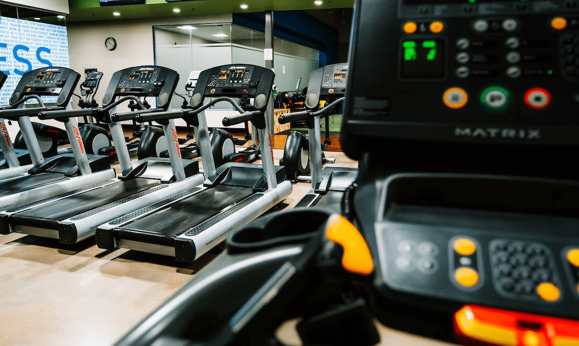 treadmill speeds on the machine's monitor in a gym