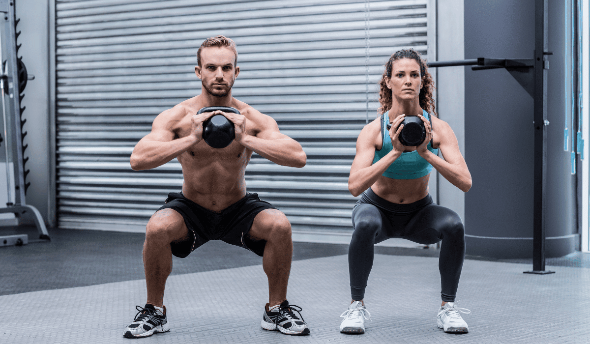 Two people doing beginner kettlebell exercises