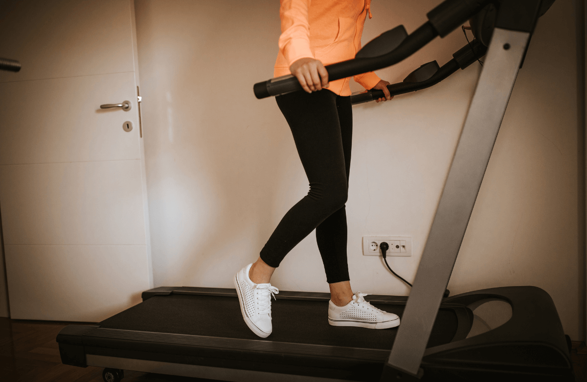 A woman training on the best treadmill under $1000 at home
