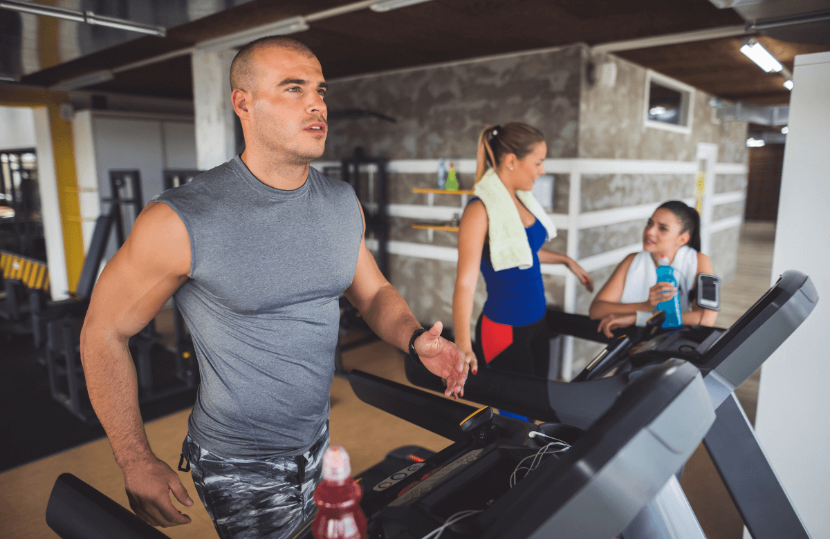 A man trying the Peloton vs NordicTrack battle at the gym