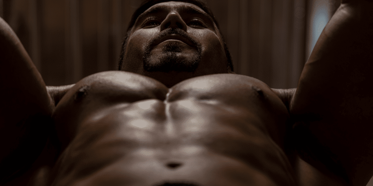 An athlete trains at the gym to get a bigger chest