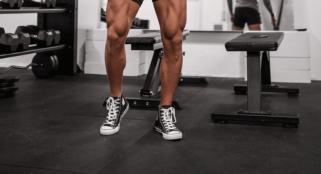 Bodybuilder wears converse for lifting