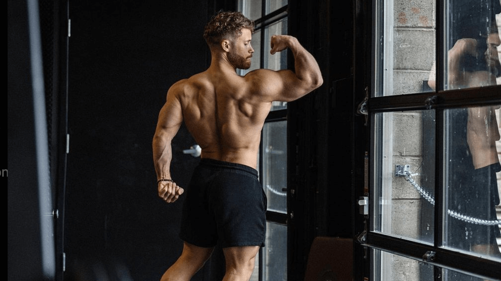 Jeff Nippard showing his back and biceps